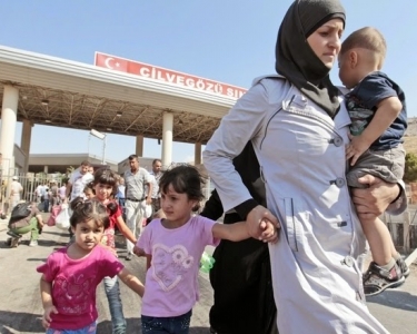 Do Syrian refugees receive a salary from the Turkish state
